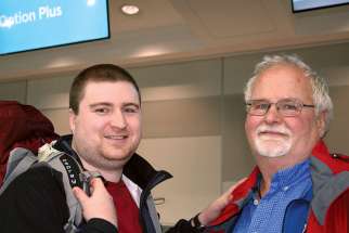 Chris Harshman is seen off by his father James at Toronto’s Pearson Airport as he embarks May 4 on his fundraising trek from the Vatican to Santiago de Compostela, Spain. Harshman’s journey will raise money for Mary’s Meals Canada to feed undernourished kids in Malawi.