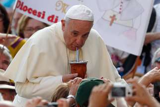 Pope Francis drinks mate, the traditional Argentine herbal tea, as he arrives to lead his general audience in St. Peter&#039;s Square at the Vatican Aug. 27, 2014. The tea was presented by someone in the crowd. In Argentina, drinking mate is a social event and helps to lower cholesterol.