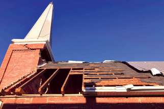 The damage from post-tropical storm Fiona to St. Martin of Tours Church in Cumberland, P.E.I. is evident as part of the roof was torn off.
