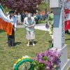 Sr. Loretta Gaffney, centre, a member of the Religious Hospitallers of St. Joseph in Kingston, Ont., bows her head after laying a wreath to remember one of the order’s members who died aiding victims of the Irish potato famine who passed through Kingston.