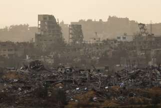 Buildings lie in ruin in Gaza as seen from southern Israel Dec. 12 amid the ongoing conflict between Israel and the Palestinian Islamist group Hamas.