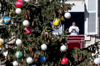 Pope Francis leads the Angelus from the window of his apartment overlooking St. Peter&#039;s Square Dec. 18 at the Vatican.