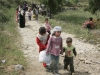 Syrian children and women arrive in Dabbabieh, in northern Lebanon, May 16. Pope Benedict XVI renewed his appeal for a negotiated settlement in Libya and called for an end to bloodshed in Syria, where civil strife has left hundreds of people dead.