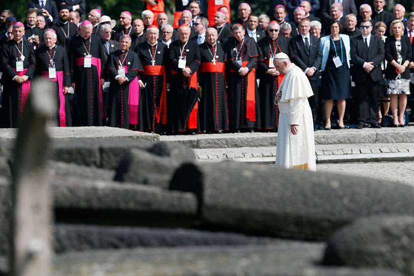 Pope pays tribute to Holocaust victims in silence, prayer