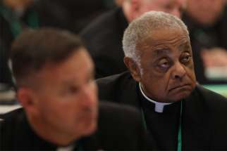 Washington Archbishop Wilton D. Gregory listens to a speaker on the first day of the spring general assembly of the U.S. Conference of Catholic Bishops in Baltimore June 11, 2019.