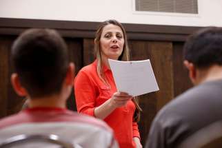 Maureen Antwan practices with the Holy Family Mission children&#039;s choir at a church in Phoenix March 25. Her family fled Iraq in 2004 out of fear of war and persecution.