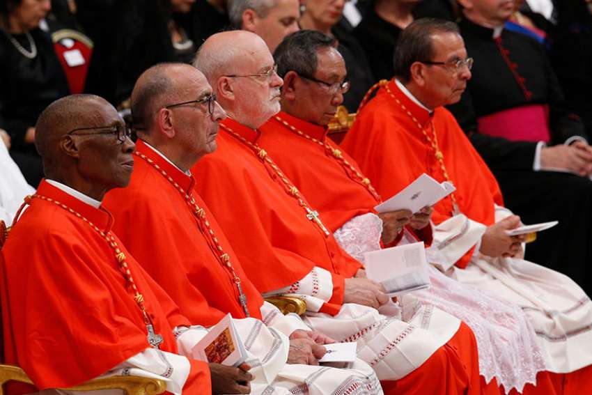 New Cardinals look on as Pope Francis leads a consistory in St. Peter&#039;s Basilica at the Vatican June 28. Pictured are Cardinals Jean Zerbo of Bamako, Mali; Juan Jose Omella of Barcelona, Spain; Anders Arborelius of Stockholm; Louis-Marie Ling Mangkhanekhoun of Pakse, Laos; and Gregorio Rosa Chavez of San Salvador, El Salvador.