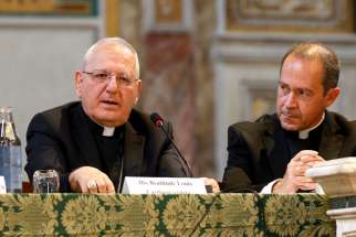 Cardinal Louis Raphael I Sako, the Chaldean Catholic patriarch, speaks during the presentation of the UK Independent Review on Persecution of Christians, in Rome July 15, 2019. Looking on is Msgr. Antoine Camilleri, an official at the Vatican Secretariat of State.