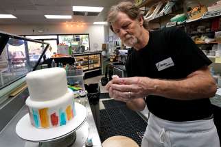  Baker Jack Phillips decorates a cake in his Masterpiece Cakeshop Sept. 21, 2017, in Lakewood, Colorado. 