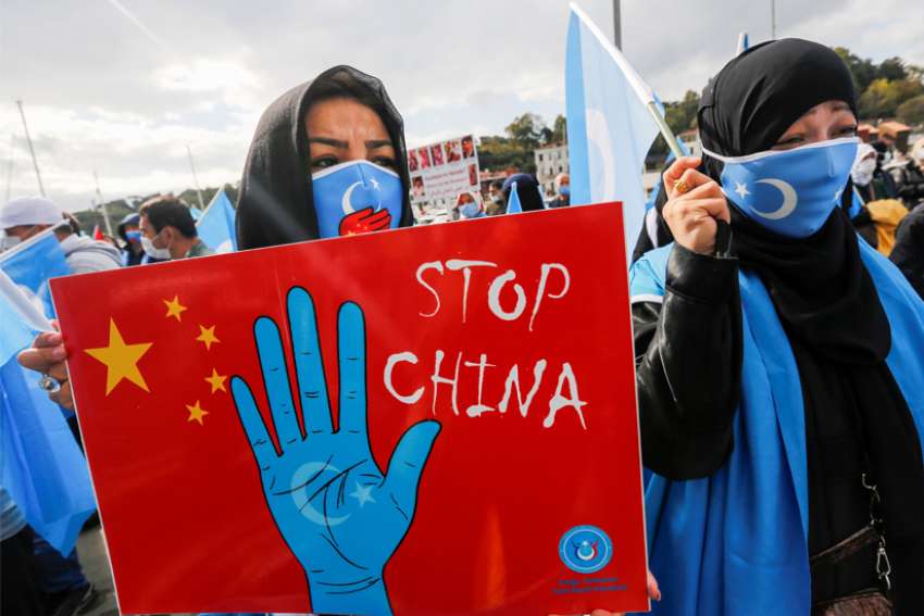 Ethnic Uyghur demonstrators take part in a protest against China in Istanbul Oct. 1, 2021.