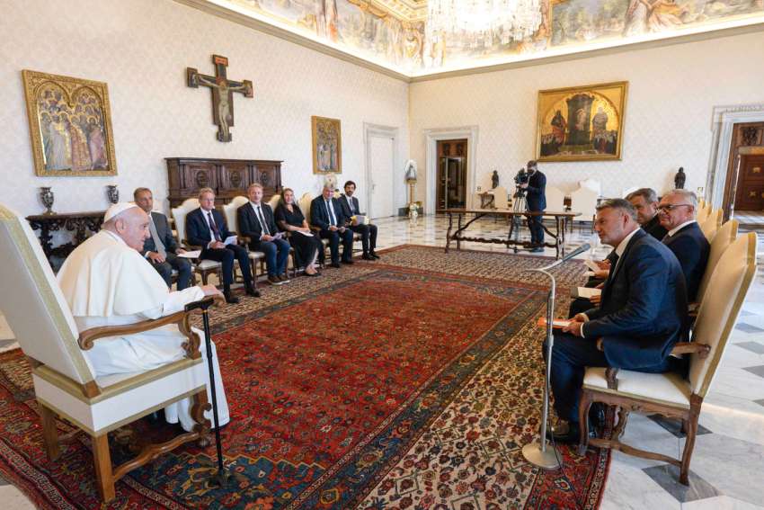 Pope Francis speaks to a delegation of European lawyers in the library of the Apostolic Palace at the Vatican Aug. 21, 2023. Thanking the lawyers for their advocacy of environmental protection laws, the pope announced he was writing another document on the environment.