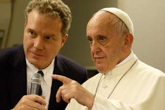  Greg Burke, Vatican spokesman, is seen with Pope Francis aboard the flight from Dhaka, Bangladesh, to Rome Dec. 2, 2017.