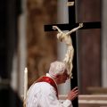 Pope Benedict XVI venerates a crucifix as he leads the Good Friday service in St. Peter&#039;s Basilica at the Vatican April 6.