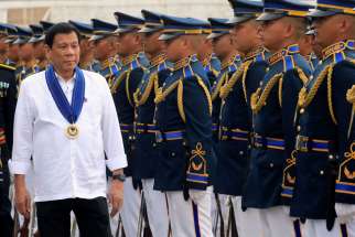 Philippine President Rodrigo Duterte reviews honor guards upon his arrival at the Villamor air base in Manila. The head of the Philippine bishops&#039; conference set &quot;ethical guidelines&quot; against proposals to reinstate the death penalty as the country&#039;s war on drugs continues, with body counts increasing daily.