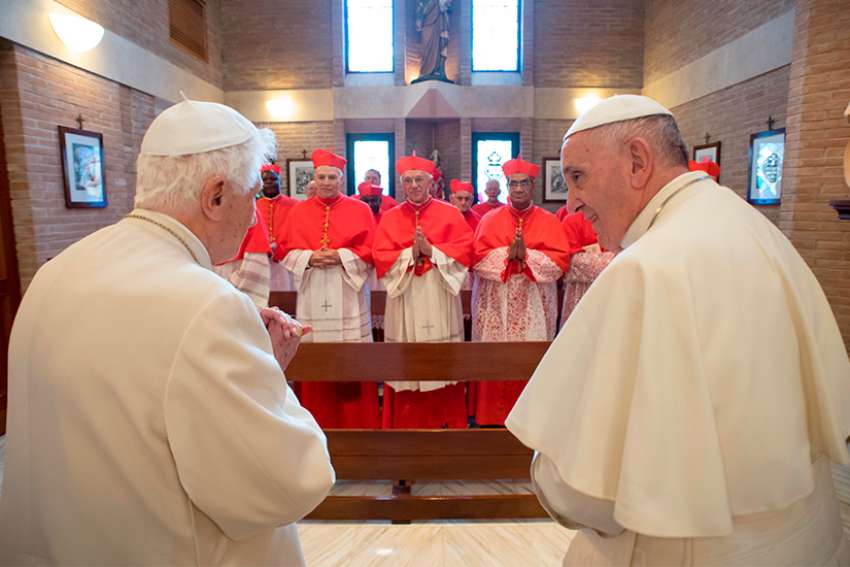 Pope Francis, right, and new cardinals visit with Pope Emeritus Benedict XVI at the retired pope&#039;s residence after a consistory at the Vatican Nov. 19, 2016.