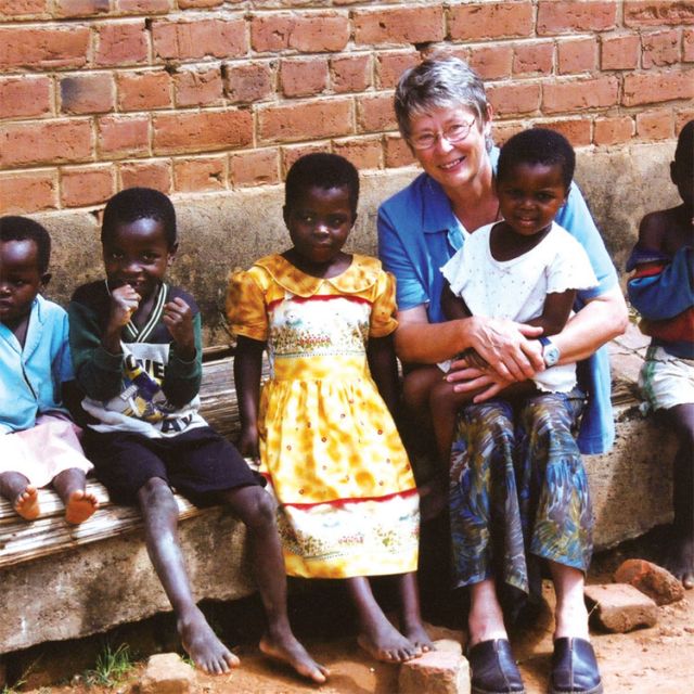 Mary Olenick, seen here with children in Malawi, said Scarboro Missions has introduced a one-year overseas mission program for young people who can’t make a three-year commitment.