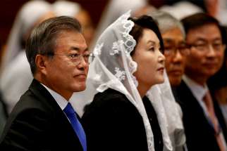  South Korean President Moon Jae-in, left, attends a Mass for peace for the Korean peninsula in St. Peter&#039;s Basilica at the Vatican Oct. 17. The Mass was celebrated by Cardinal Pietro Parolin, Vatican secretary of state.