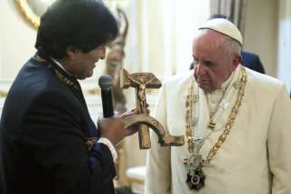 Bolivian President Evo Morales presents a gift to Pope Francis at the government palace in La Paz, Bolivia, July 8. The gift was a wooden hammer and sickle -- the symbol of communism -- with a figure of a crucified Christ.