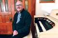 Organist Gordon Mansell has been helping keep alive the music of the late Msgr. John Ronan.
