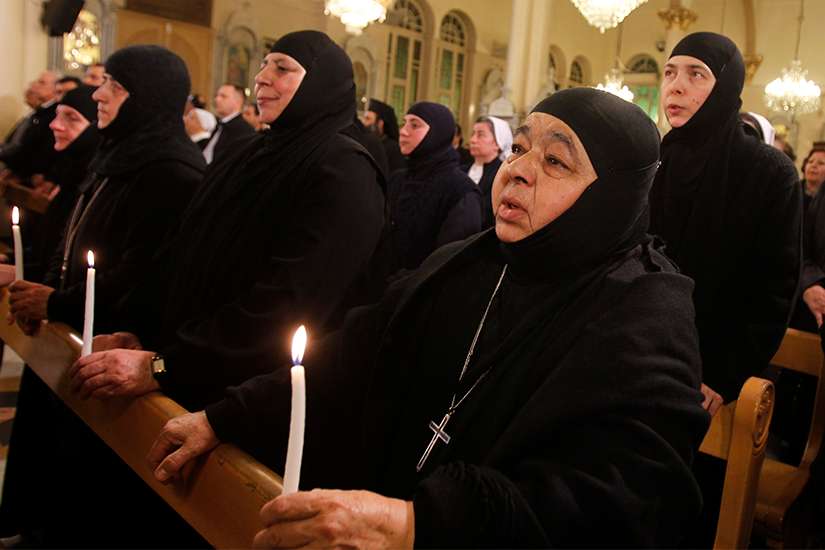 Women religious, who were freed after being held by rebels for more than three months, attend a 2014 prayer service at Holy Cross Church in Damascus, Syria, after their release. 
