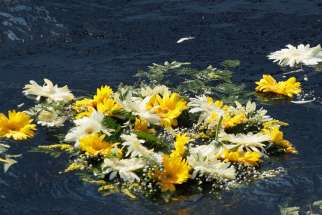 A wreath of flowers thrown by Pope Francis floats in the Mediterranean Sea in the waters off the Italian island of Lampedusa in this July 8, 2013, file photo. The pope threw a wreath to honor the memory of immigrants who have died trying to cross from Af rica to reach a new life in Europe. Marking the first anniversary of his Lampedusa visit, the pope said the the tragic deaths of thousands searching for a better future should trigger compassion and action, not indifference.