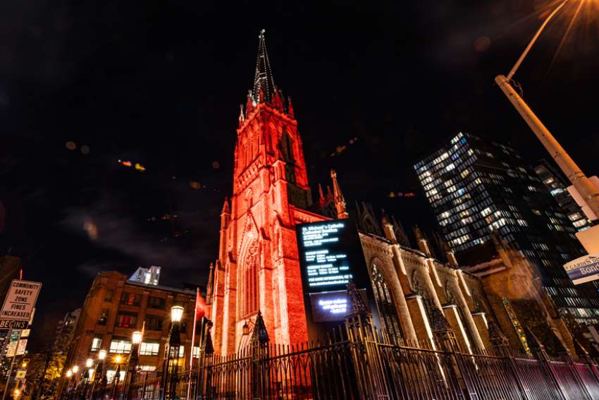 St. Michael&#039;s Cathedral Basilica in Toronto is illuminated by red lights for Red Wednesday, Nov. 16, 2022. Red Wednesday is an annual commemoration for persecuted Christians around the globe.